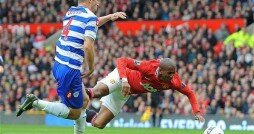 Ashley Young takes a tumble at the slightest of contacts from Shaun Derry